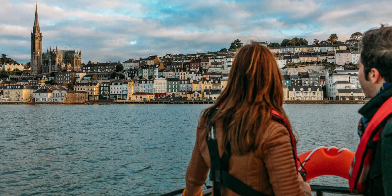 two people looking out across water